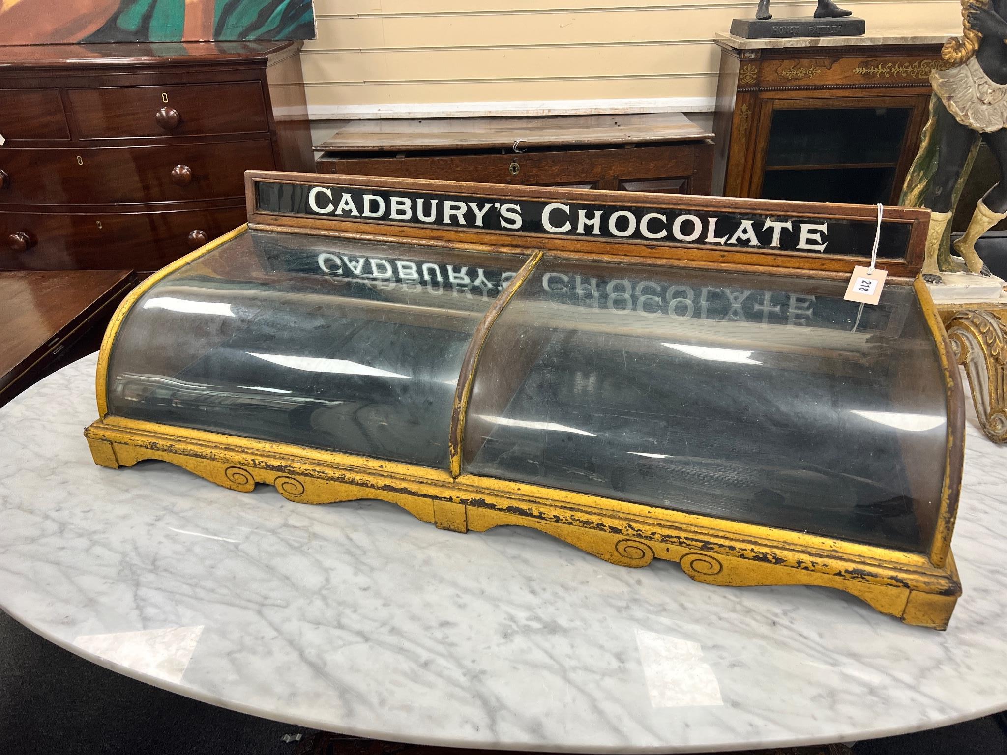 An early 20th century parcel gilt mahogany Cadbury's Chocolate table top shop display cabinet width 96cm, depth 39cm, height 28cm.